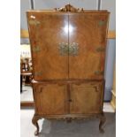 A 1930's early Georgian style cocktail cabinet in burr walnut, 35"