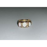 A 9 carat Victorian style dress ring set opal and diamond simulant, 3.4 gm