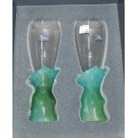 A pair of modernist glass flutes with naturalistic green bases by Daum, in original box