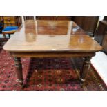 A Victorian mahogany dining table with rounded rectangular top, 2 spare leaves, on octagonal