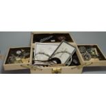 A cream leather jewellery case and costume jewellery