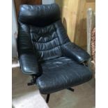 A modern reclining armchair in black leather