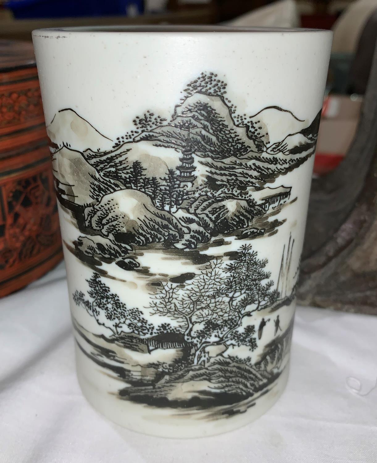 A Chinese white bisque porcelain brush pot, bitong, enamelled landscape decoration, 12 cm