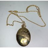 A 9 carat gold oval locket and chain, gross weight 15.3 gm