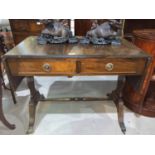 A Georgian style mahogany sofa table with frieze drawers, on shaped reeded supports, on splay feet