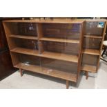 A pair of 1970's bookcases with sliding glass doors, 48"