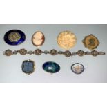 A micro mosaic brooch depicting St Peters; a cameo brooch stamped '9Kt'; a micro mosaic bracelet;