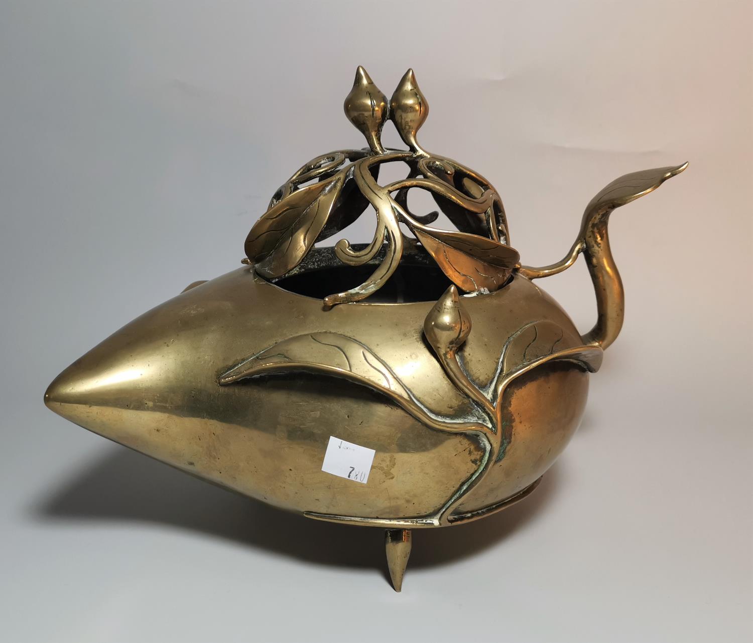 A Chinese large brass incense burner of peach form, the domed lid with open scrollwork branch and