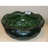 An Art Nouveau iridescent green glass circular bowl in the style of Loetz, with trellis relief