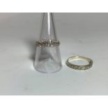 A 1970's 9 carat hallmarked gold dress ring set with numerous small alternating circular and