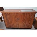 A 1970's Danish rosewood side cabinet/serving table, the top inset stainless steel hotplate, 58" x