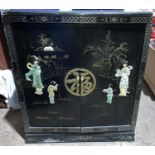 A Chinese lacquer wood cocktail cabinet with applied figures