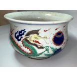 A circular Chinese Qing baluster censer bowl decorated on polychrome with dragons, diameter 25cm