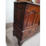 A Georgian mahogany corner cabinet with astragal glazed door