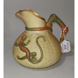A Royal Worcester squat jug in peach blush basket weave, decorated in relief with a lizard, 16 cm