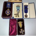 A hallmarked silver gilt and enamel masonic jewel; 2 Buffalo medallions; a yard o'led propelling