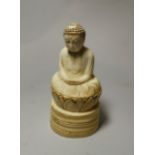 A Japanese seated Buddha figure, red seal mark to base, height 9.5 cm