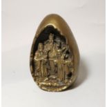 A 20th century Chinese brass egg shaped object with sages to the interior