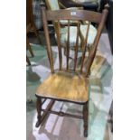 A 19th century alder wood stick back rocking chair