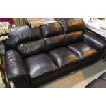 A mod 3 seater settee and matching armchair in black leather effect