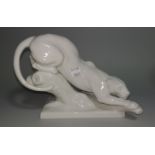 A late Meissen blanc de chine figure of a panther, crossed swords mark. length 21 cm