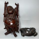 A 19th/20th century large hardwood carved figure of Buddha with outstretched arms, on detachable