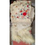 A 1920's fringed Madeira shawl, embroidered on a cream ground; a cream feather boa