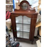 An Edwardian inlaid mahogany display cabinet in the Sheraton style with painted swag decoration,