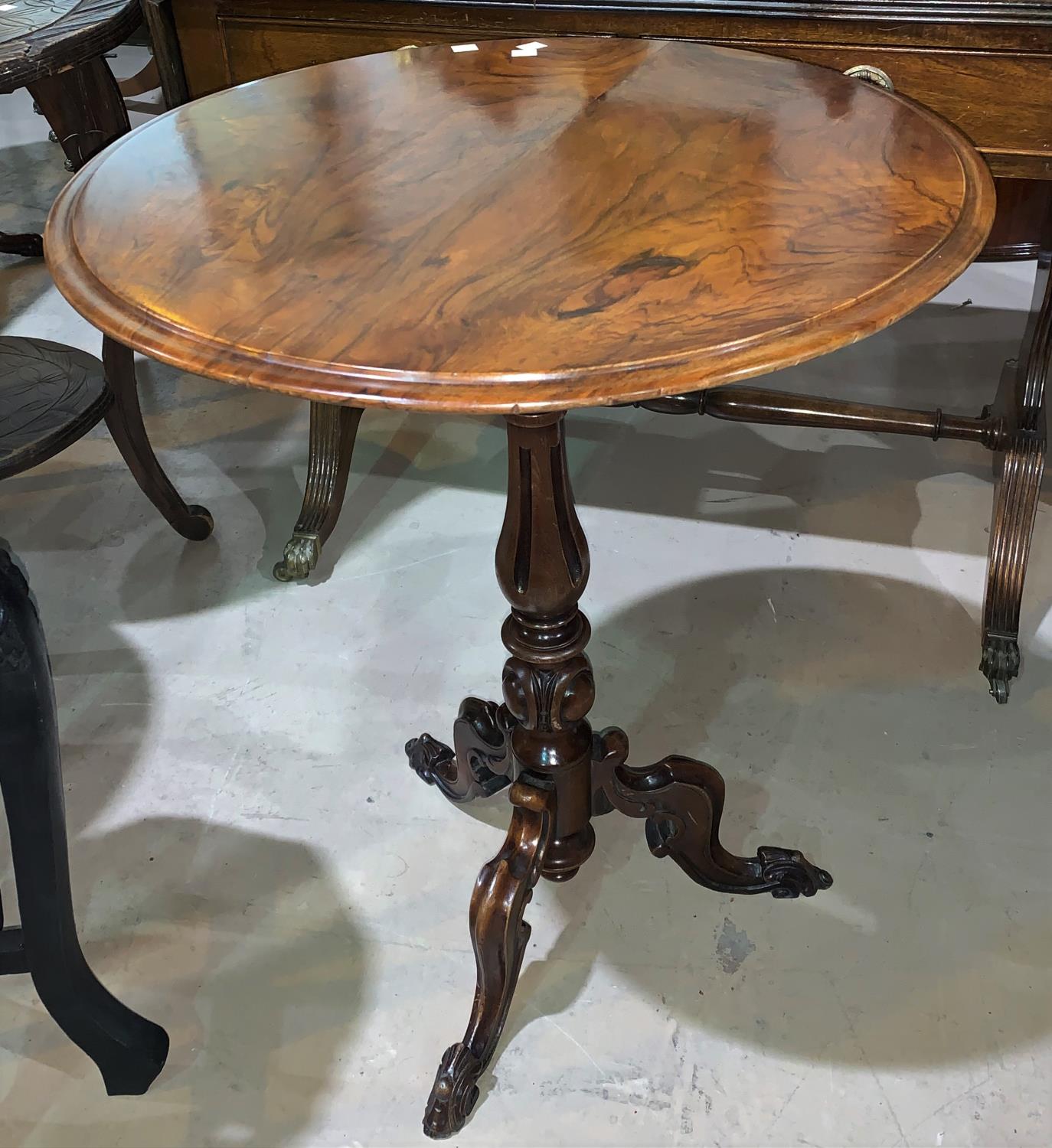 A Victorian tripod table with circular figured walnut top, 57"