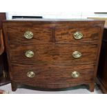 A 19th century mahogany bow front chest of 2 long and 2 short drawers with brass drop handles, on