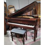 A baby grand piano by Challen, iron framed and overstrung, in mahogany case, on square tapering