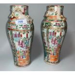 A 19th century Chinese pair of 'famille verte' vases of inverted baluster form, height 9.25" (1 a.