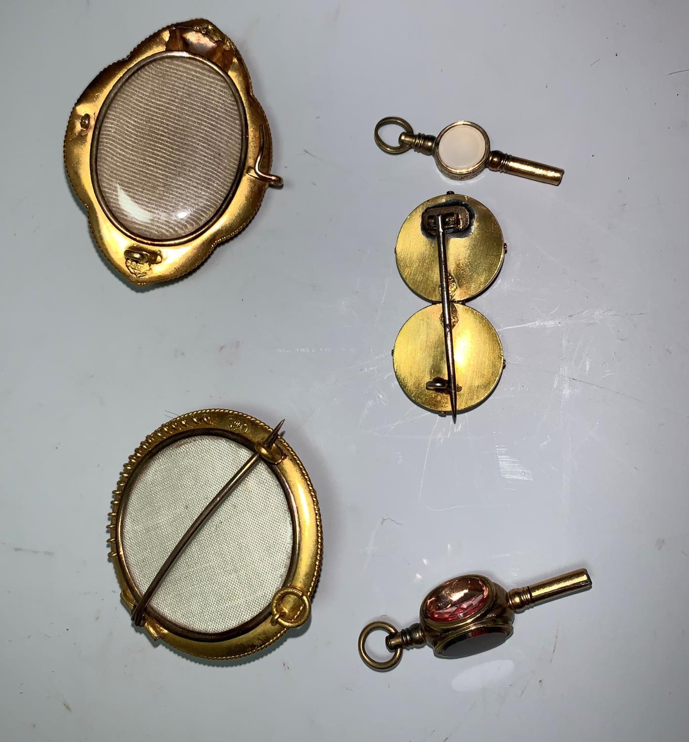 A Victorian suite of jewellery comprising circular brooch and pair of earrings; another brooch - Image 2 of 2
