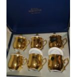 A Royal Worcester set of gilt porcelain chocolate cups; similar ramekins; other similar china