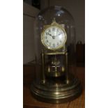 An early 20th century brass 400 day/anniversary clock, with glass dome, 28 cm high overall