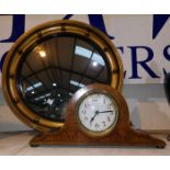 An Edwardian mantel clock in inlaid mahogany case; a convex gilt ball wall mirror; brassware;