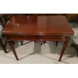 A Georgian period figured mahogany tea table, turnover top and end frieze drawer, 91 cm