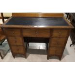 An Edwardian inlaid mahogany kneehole desk with 7 drawers, width 107 cm