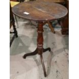 An early 19th century circular mahogany wine table on tripod base