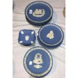 A collection of Wedgwood blue Jasperware plates, including 6 Christmas plates; 10 smaller plates and