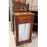 An Edwardian rosewood display cabinet with mirror back and glazed door