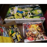 A boxed Lego set; loose Lego; a Magnext game