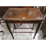 An early 20th mahogany side/card table, the fold-over top with gadrooned rim, on square legs