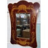 A rectangular wall mirror in stained and coloured frame with classical decoration; a Georgian