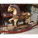 An antique style rocking horse with fairground painted finish