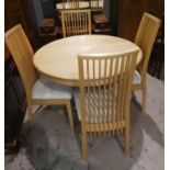 A modern lightwood dining suite with extending circular table and 4 high rail back chairs