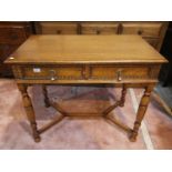 A 1930's golden oak side table with 2 frieze drawers