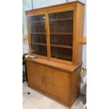 A 1930's light oak full ht bookcase