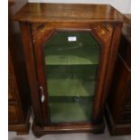A Victorian inlaid walnut music/display cabinet enclosed by glazed doors