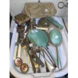 A white metal and enamel 3 piece dressing table set; a purse; a selection of silver plate cutlery;